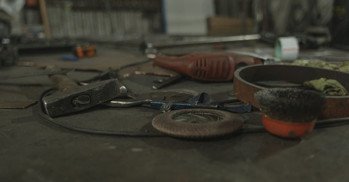 Hand tools laid out across a workshop bench.
