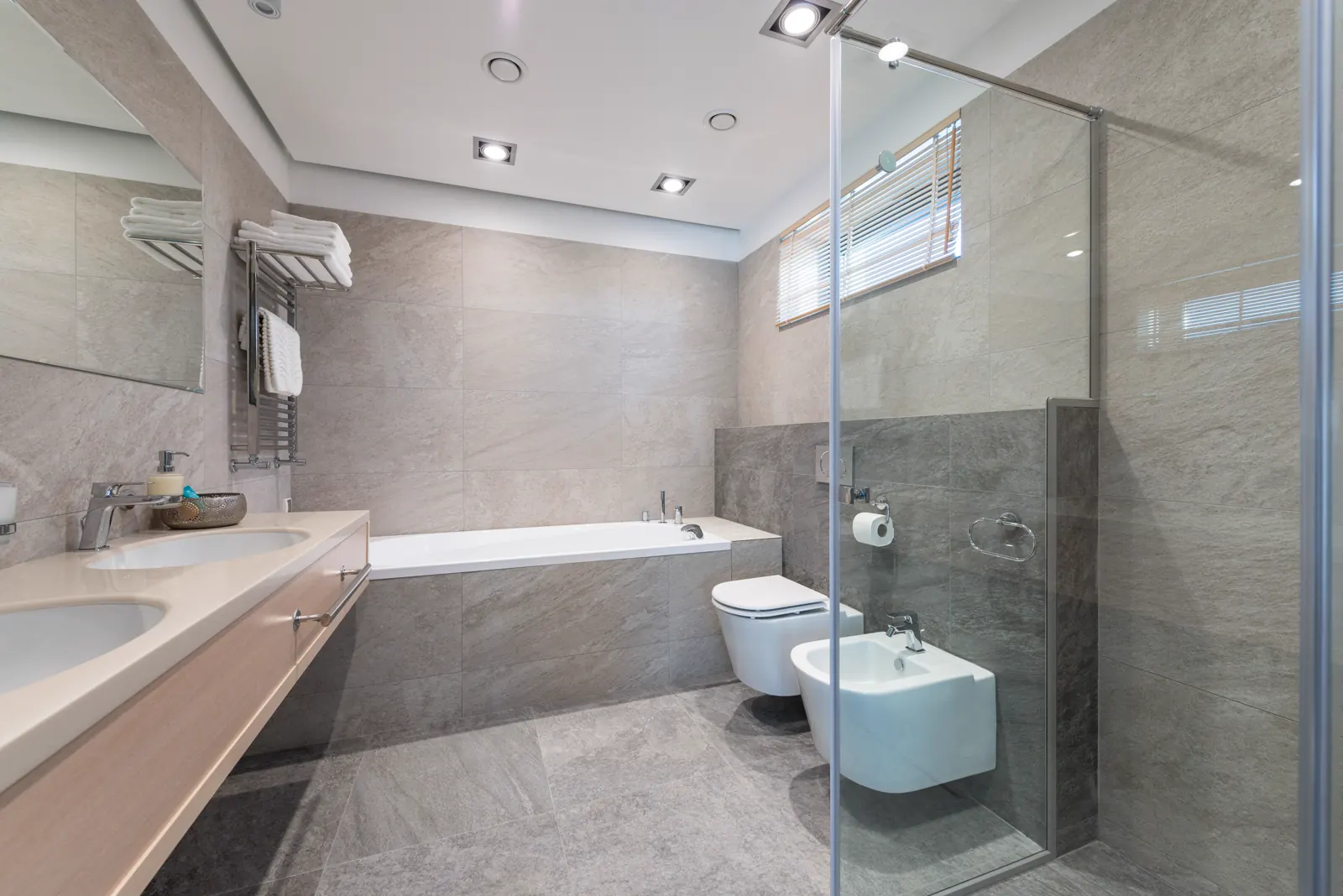 Modern bathroom with clean white surfaces.