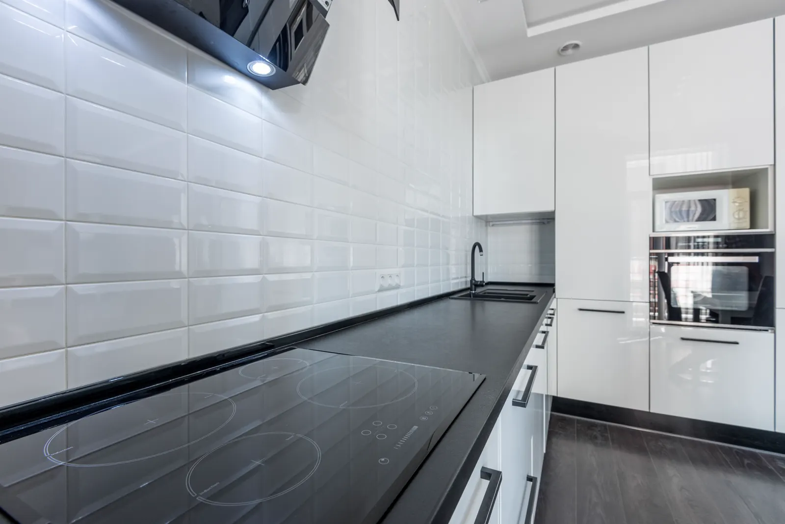 Bright white kitchen with clean worktops.