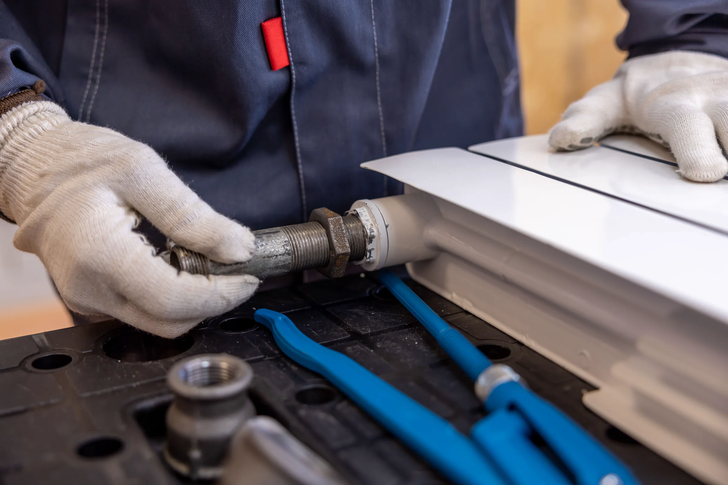 Plumber fitting a radiator pipe