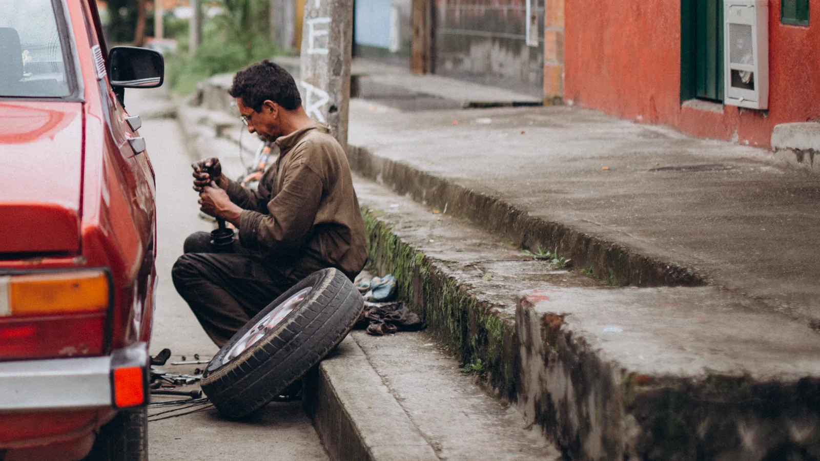 Mechanic repairing a wheel at the roadside