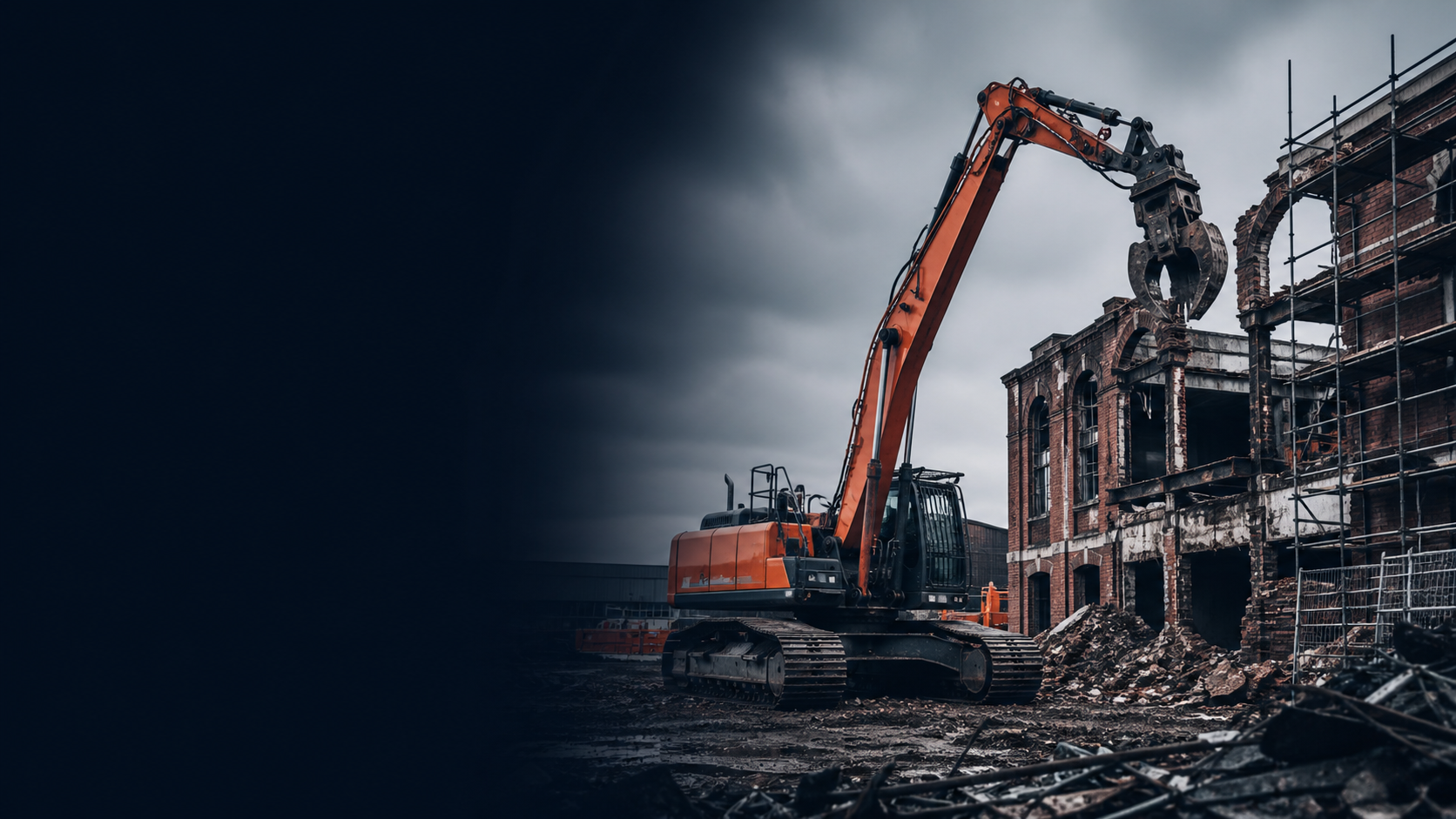 Orange excavator dismantling a red-brick industrial building on a British demolition site.